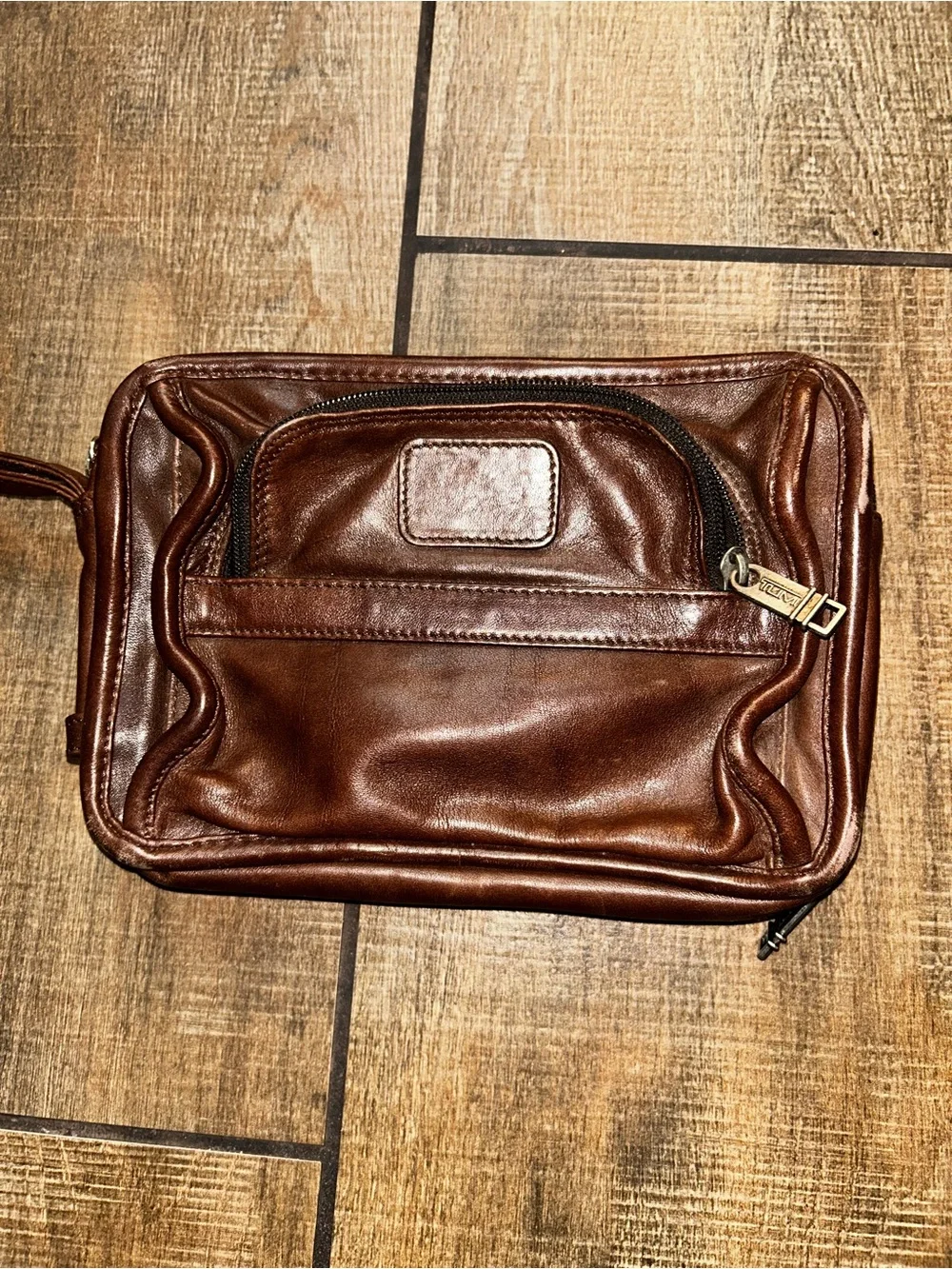 TUMI brown leather travel bag